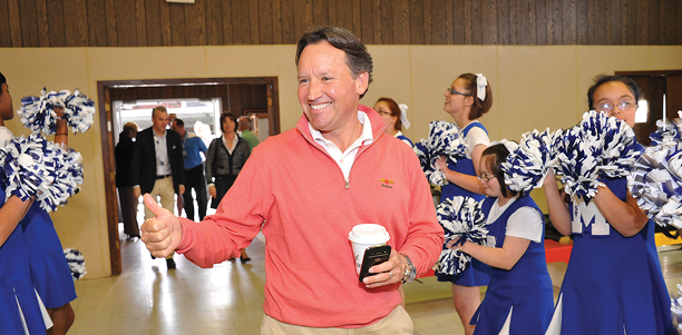 E. Randall Clouser is greeted by children at St. Michael Special School