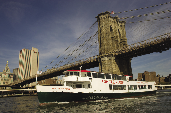 A Circle Line tour boat cruising New York’s East River
