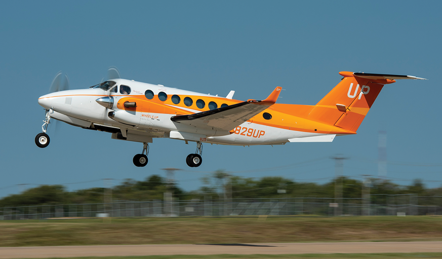 Wheels Up Cares Orange Plane Feeding America