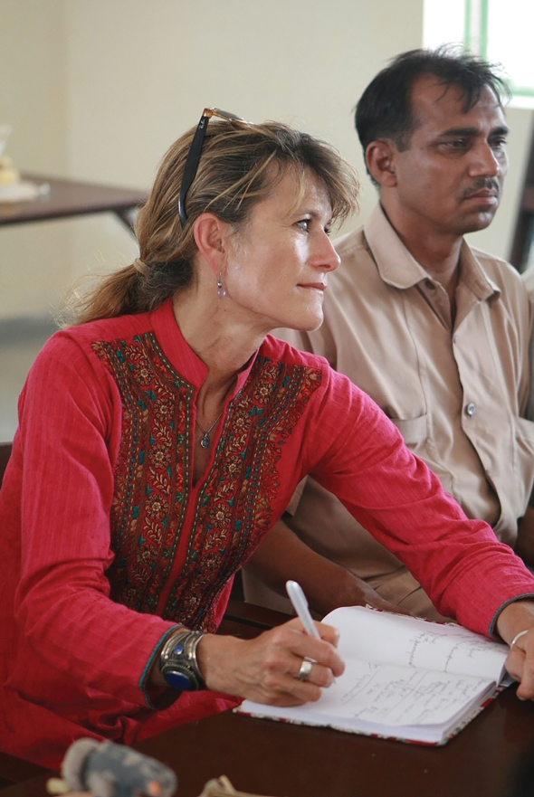 Jacqueline Novogratz with customers of AMC, Lahore, Pakistan
