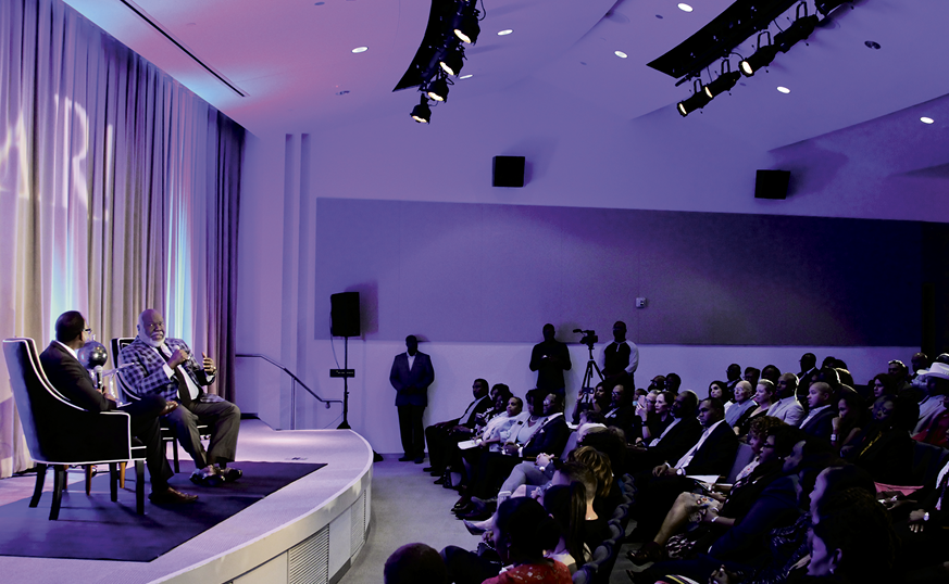 T.D. Jakes speaking to a crowd at Frontiers of Flight Museum