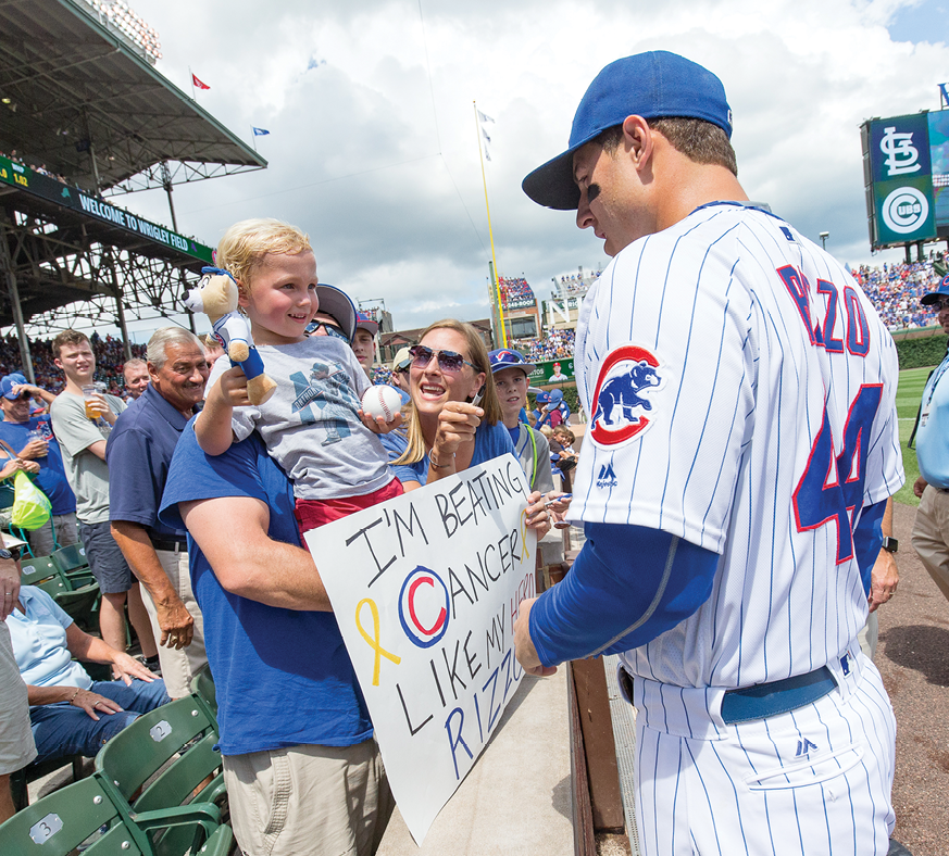 Anthony Rizzo hosting Rocco DiMaggio <br />in the Yankees dugout before a game