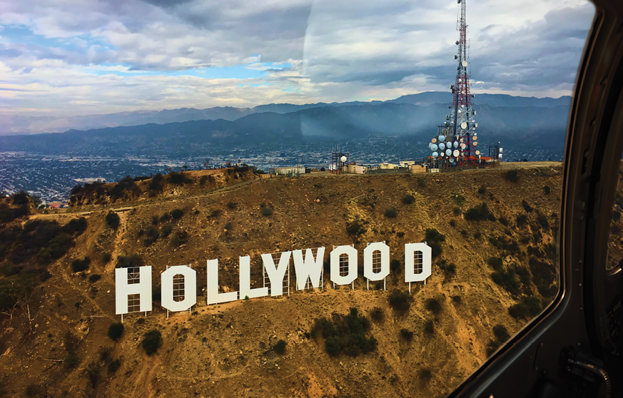A large Hollywood sign is visible on a hill.

Description generated by AI