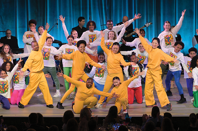 Jermaine Jones performing with NDI students